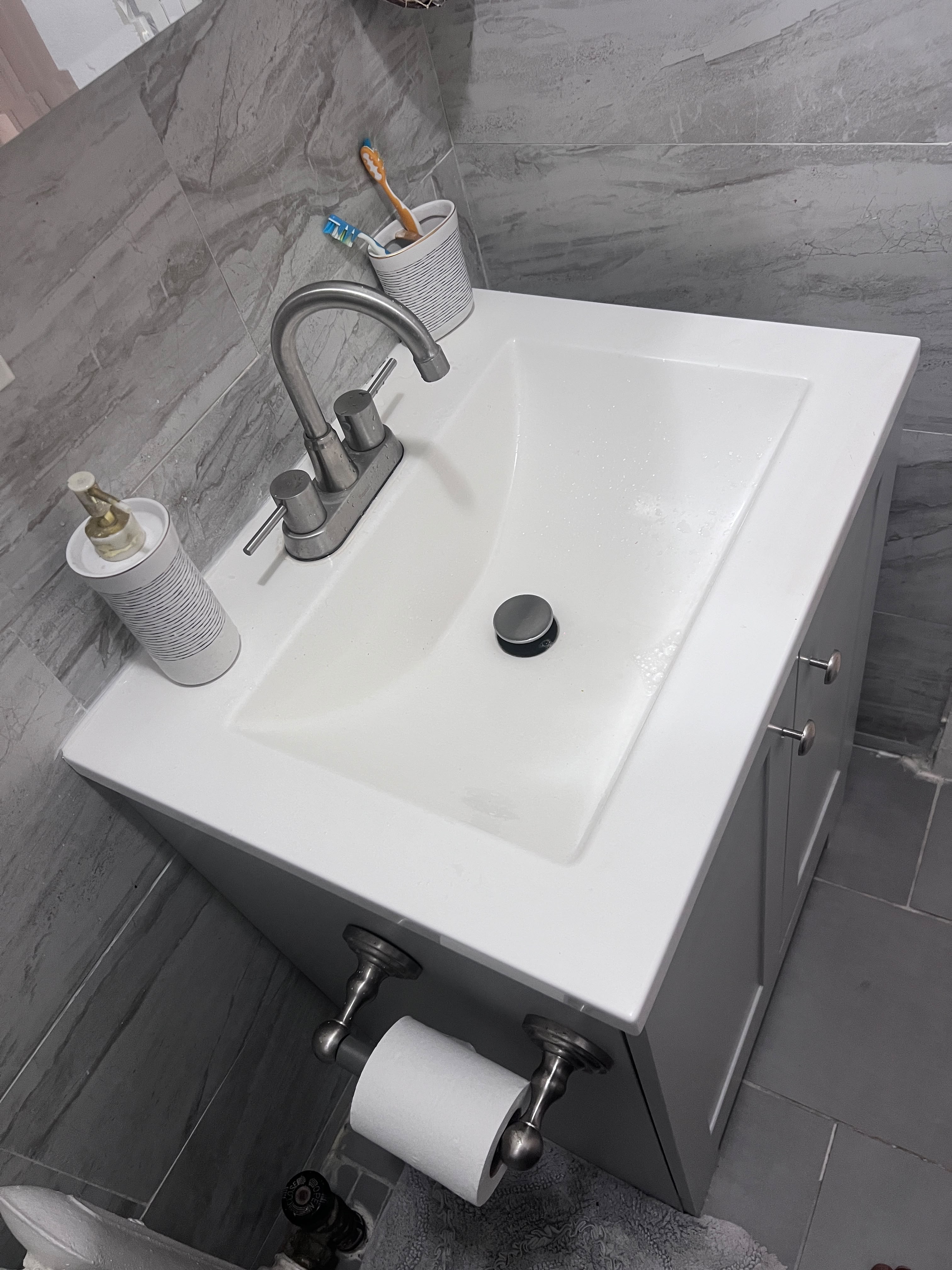 Completed gray tile bathroom